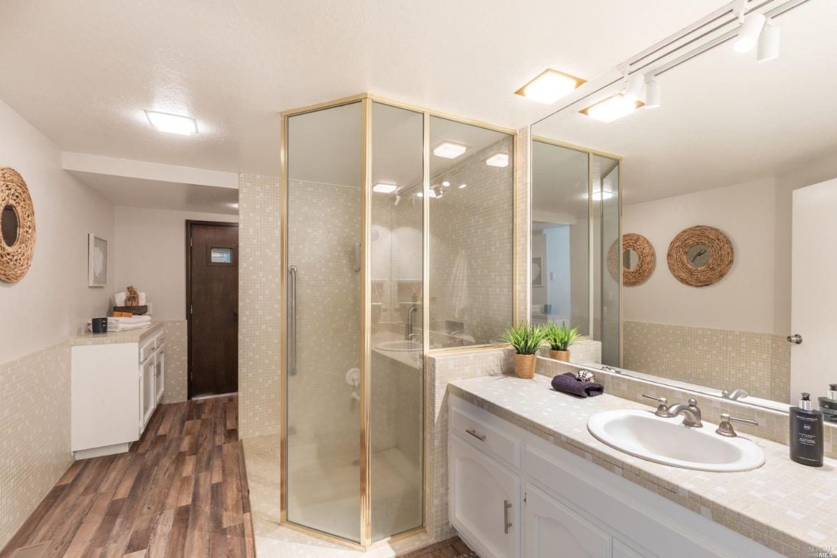 Bathroom with a sink and shower.