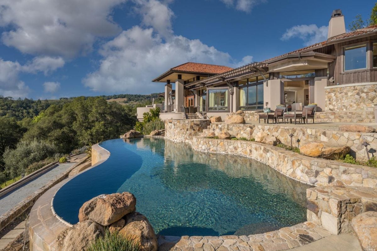 Pool with terrace and dining cabana overlooking wine country.