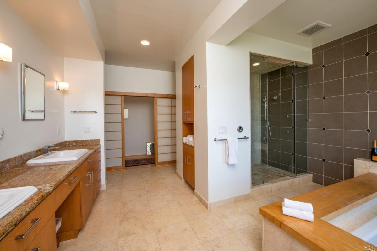 Bathroom with sink, shower and bath tub.