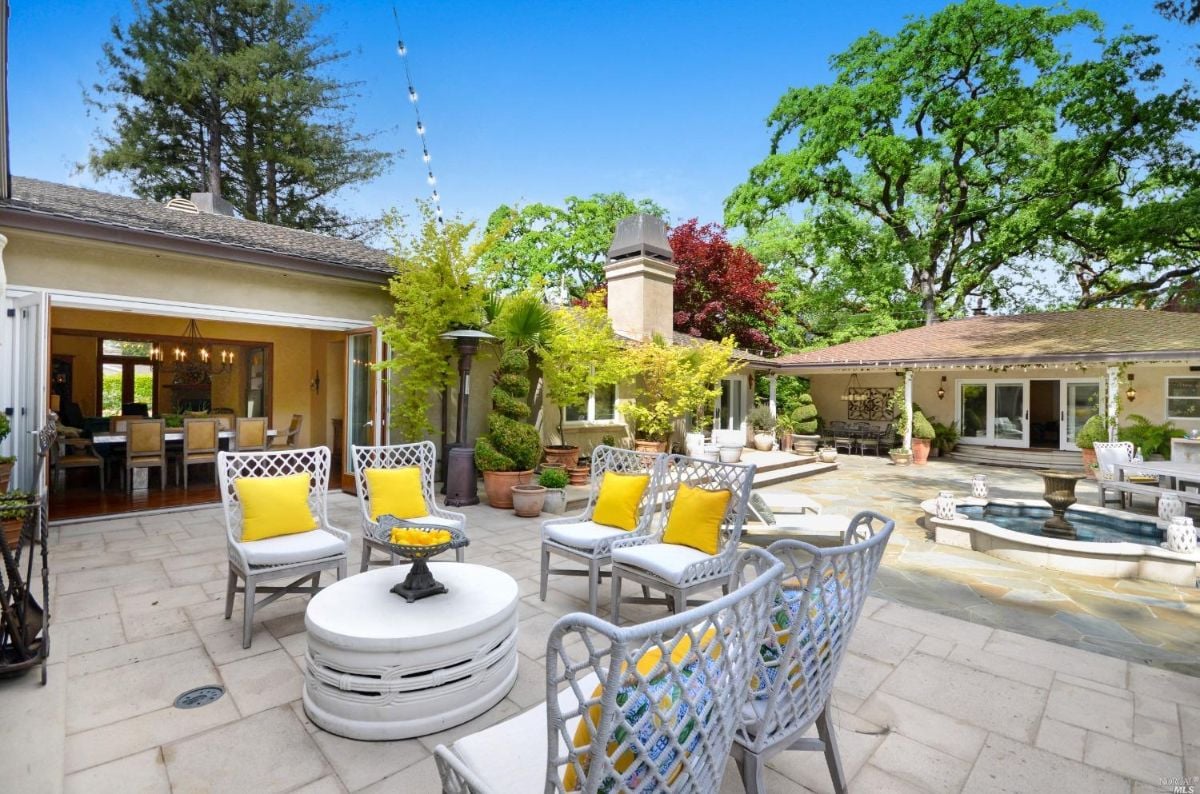 Patio with chairs and a table.