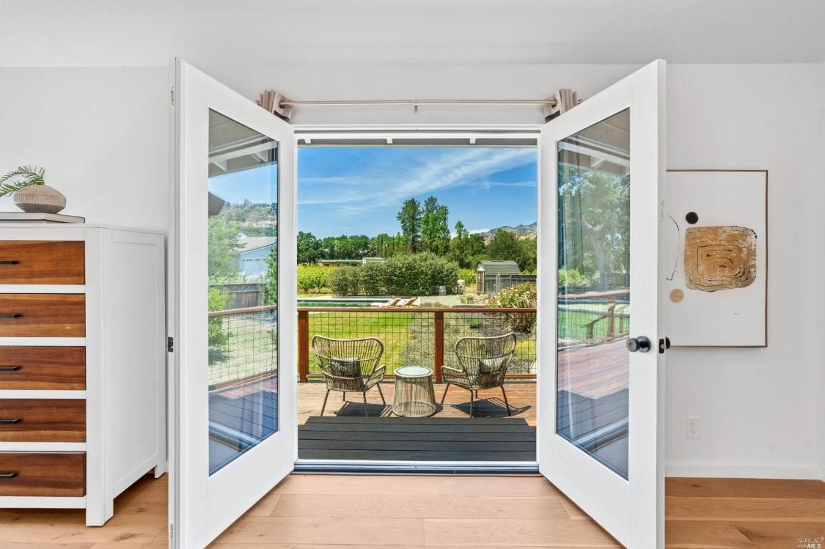 Glass doors leading to the balcony.