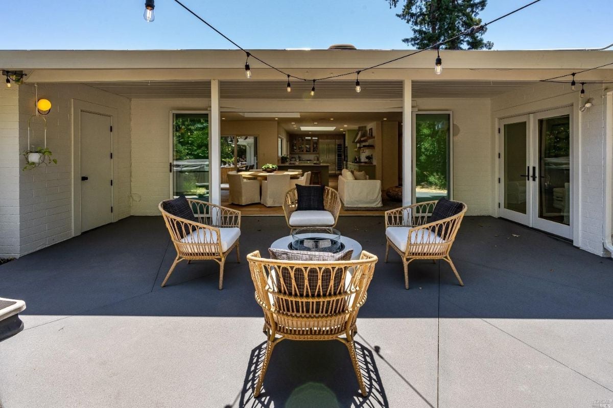Patio with chairs and a table.