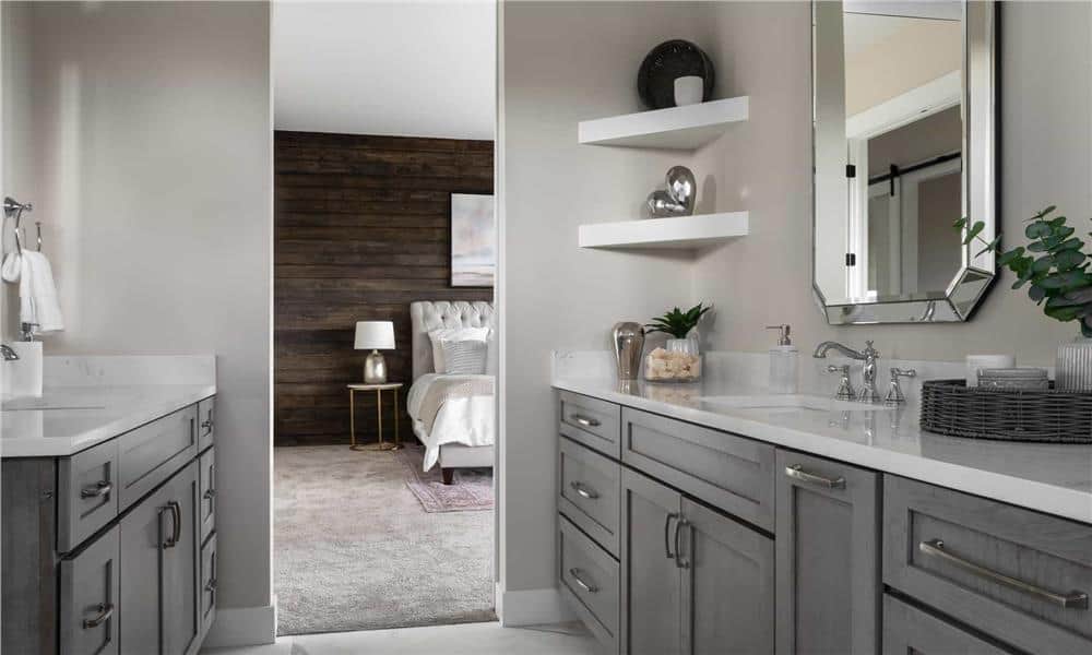 Primary bathroom with his and her vanities facing each other.