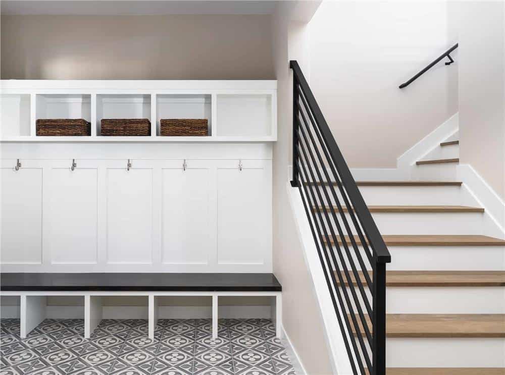 Mudroom with coat hooks, a built-in bench, and cubbies for extra storage.
