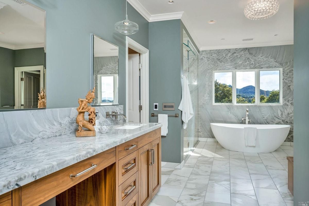 Bathroom with a sink, bath tub and shower.