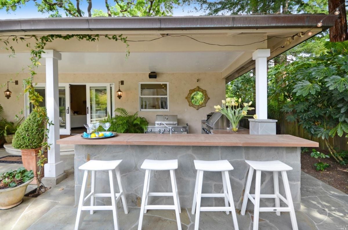 Outdoor kitchen with counter seating.