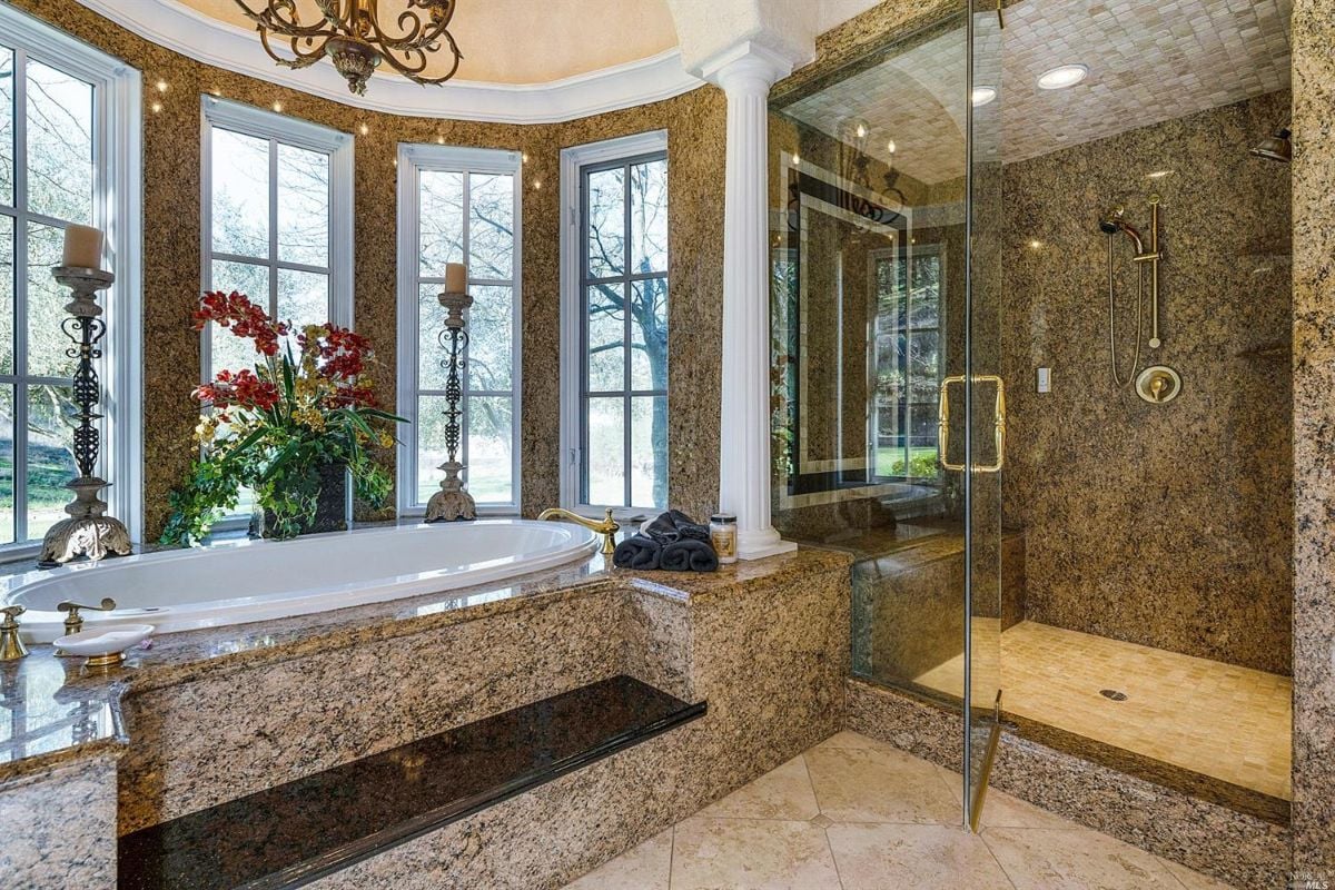 Bathroom with a tub and a shower.