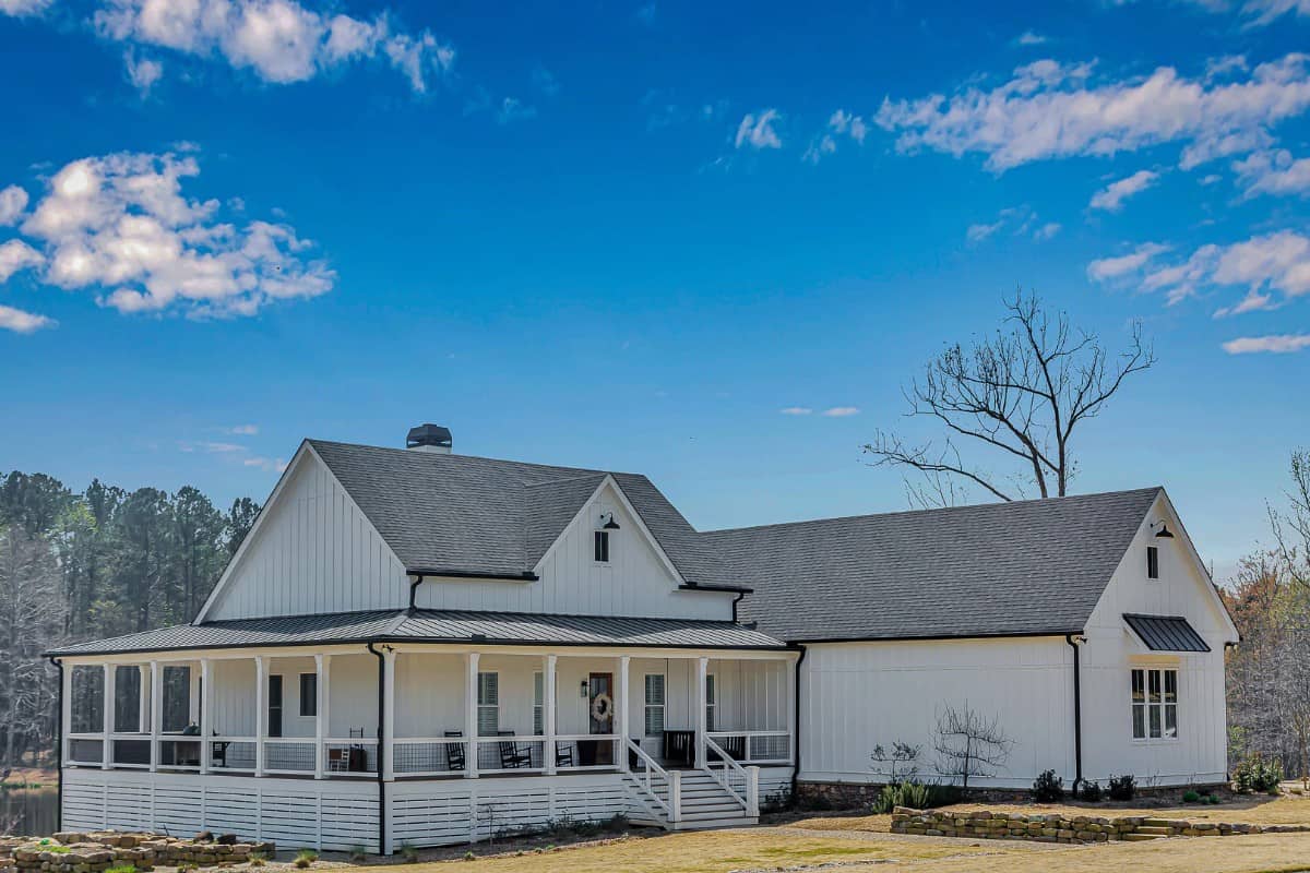 Front-left view of the house showcasing the covered wraparound porch.
