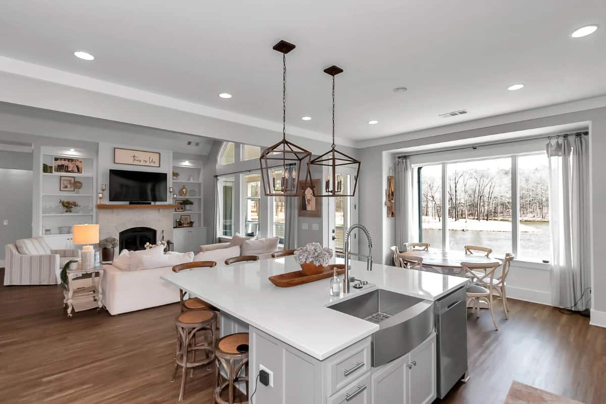 An open layout view of the family room and breakfast nook from the kitchen.