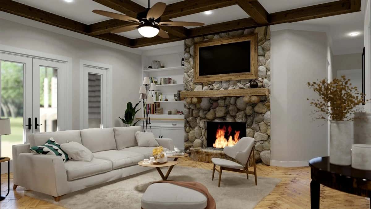 Social room with neutral seats, a stone fireplace, and outdoor access.