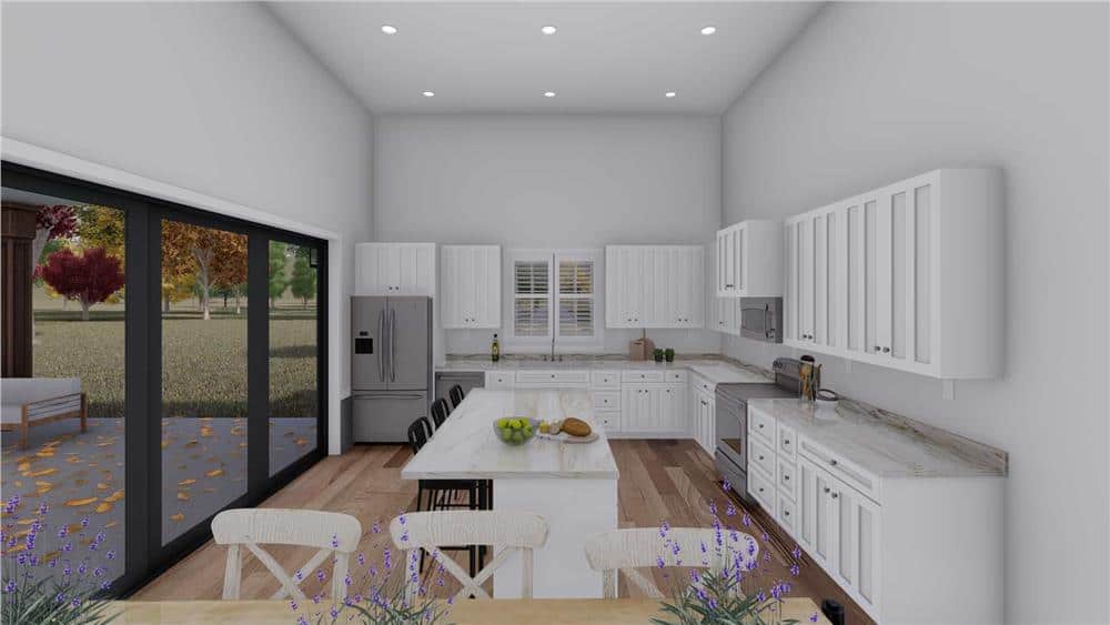 The kitchen offers plenty of storage, slate appliances, a breakfast island, and an adjoining dining area.