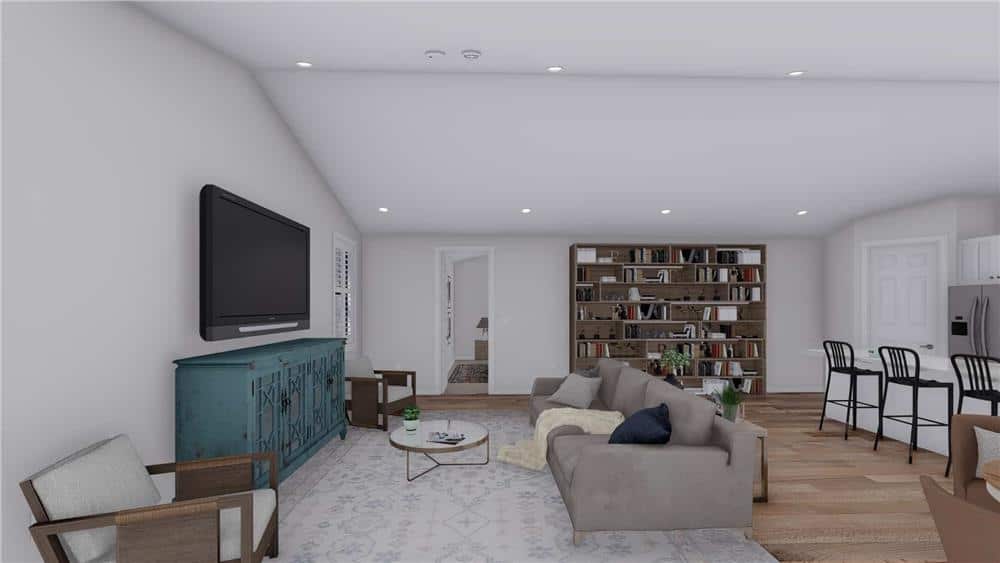 Family room with a modern sofa and a TV mounted above the distressed console table.