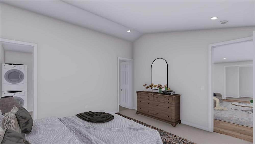 The primary bedroom includes a wooden dresser, an ensuite bath, and a walk-in closet with a stackable washer and dryer.