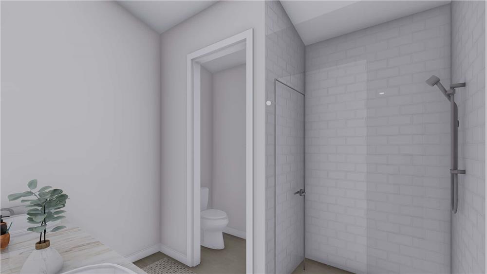 A tiled shower and a water closet complete the primary bathroom.