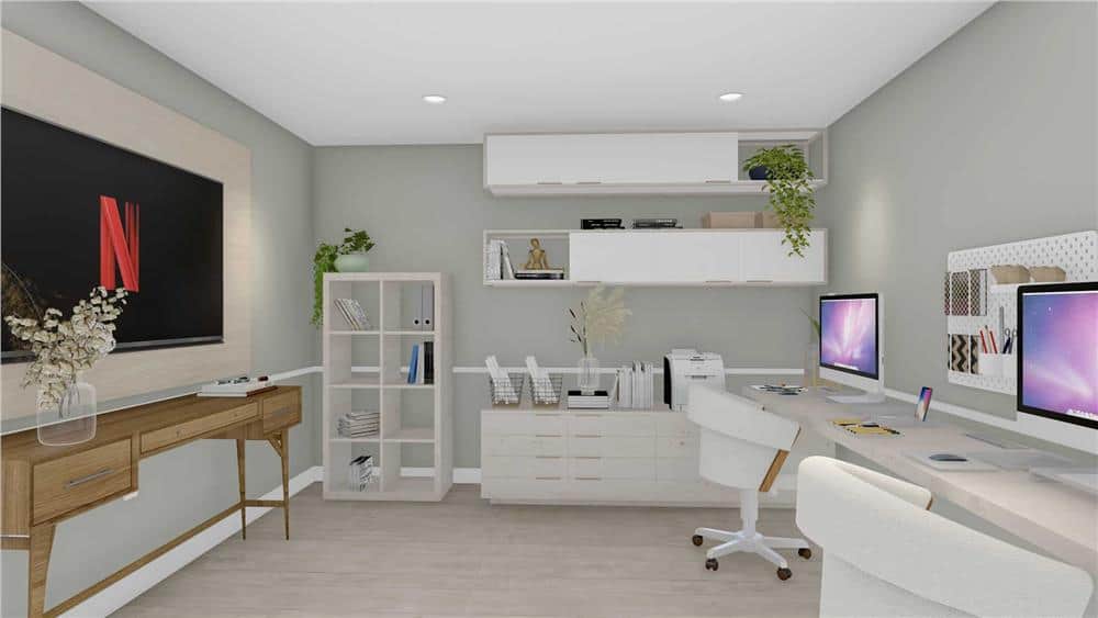 The home office offers a large TV and an elongated desk that accommodates two workspaces.