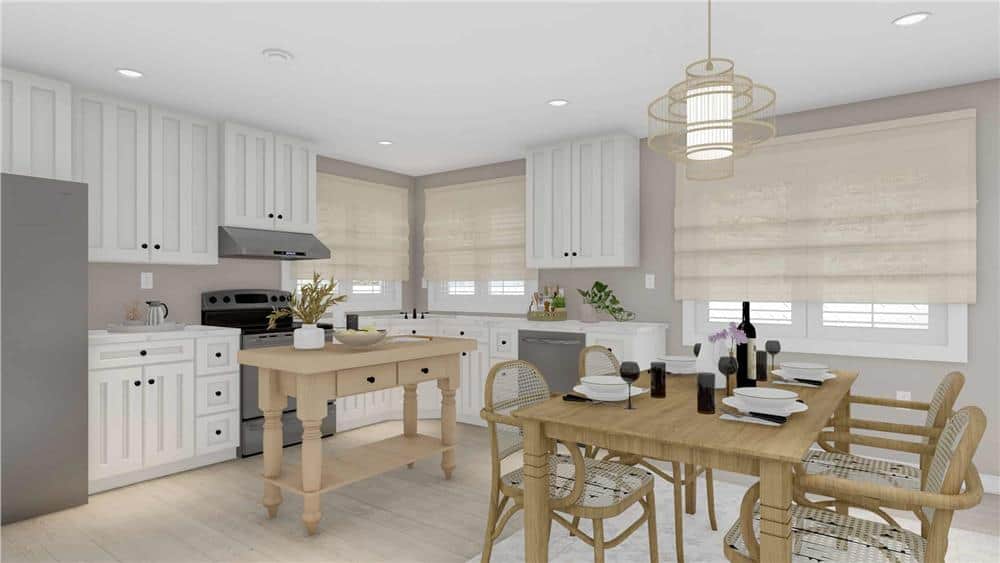 Combined kitchen and dining room with slate appliances, white cabinetry, and a center island that blends in with the hardwood floor.