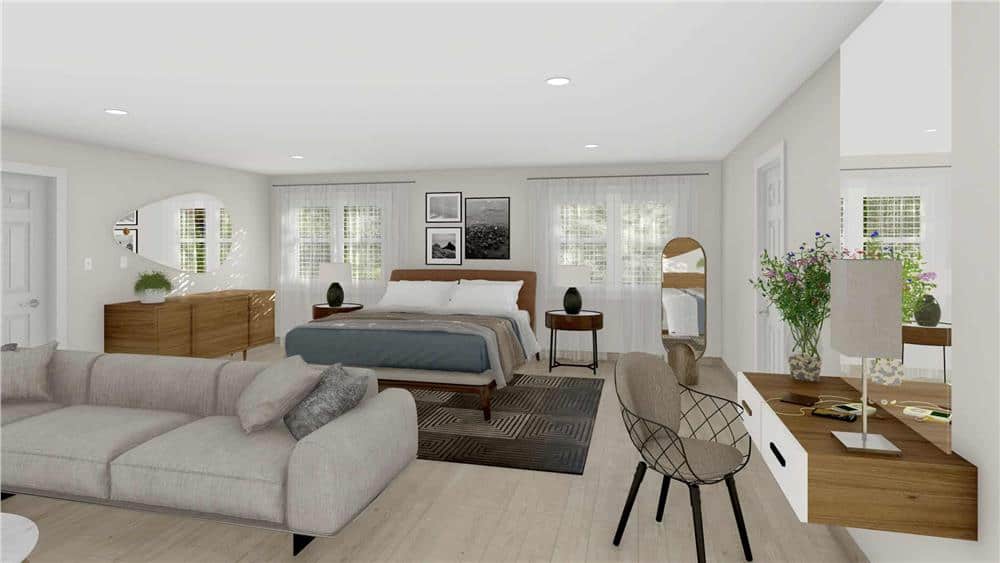 The primary bedroom has a built-in desk and a spacious sitting area with a sectional sofa.
