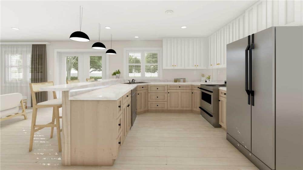 The kitchen features high-end appliances and a peninsula with a raised eating bar.