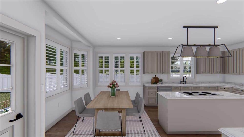 Surrounding windows and a glazed door provide the eat-in kitchen with stunning rearward views.