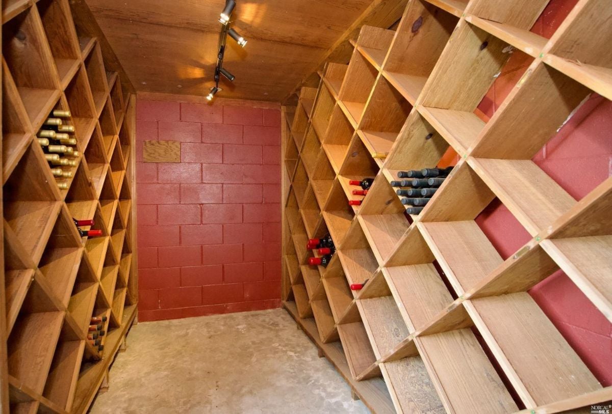 Wine cellar with shelves.