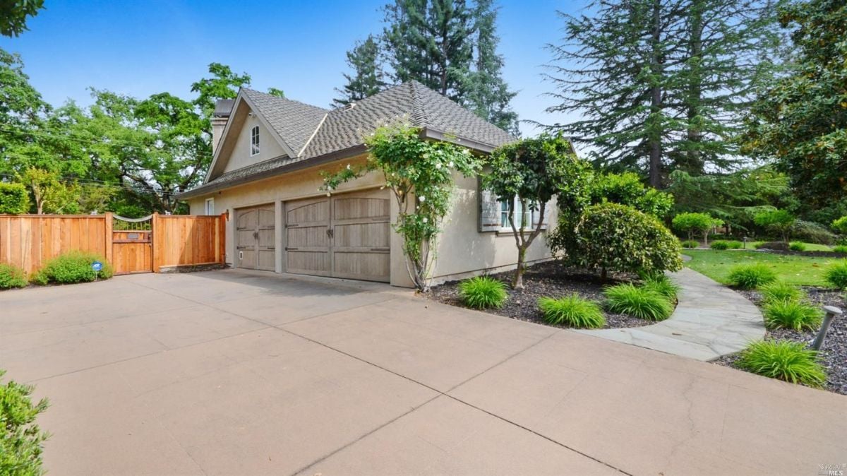 Two-car garage with a huge driveway.