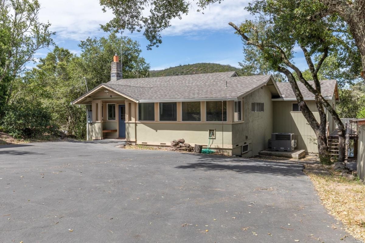 Guest house with a paved, spacious driveway.