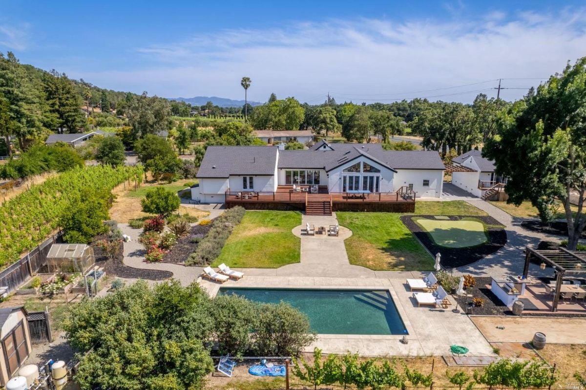 Aerial view of the mansion with pool.