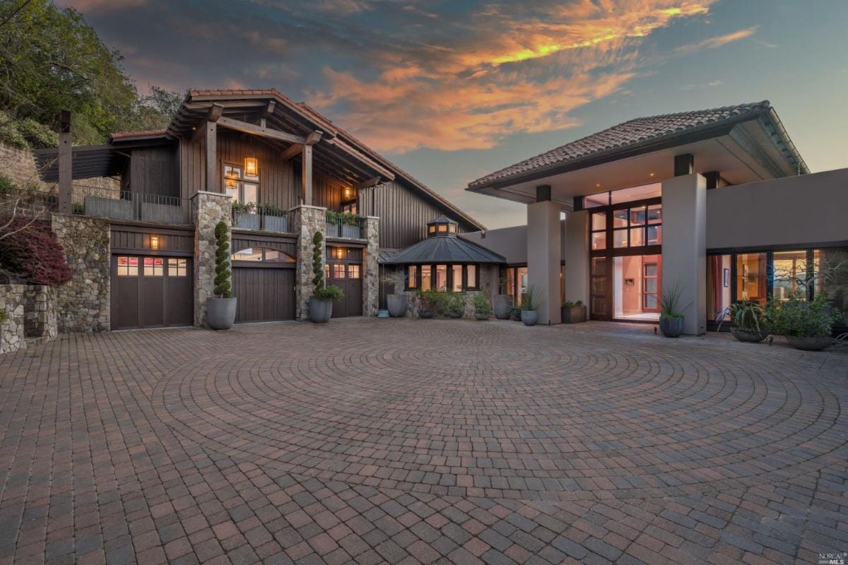 Large driveway with a brick paver.