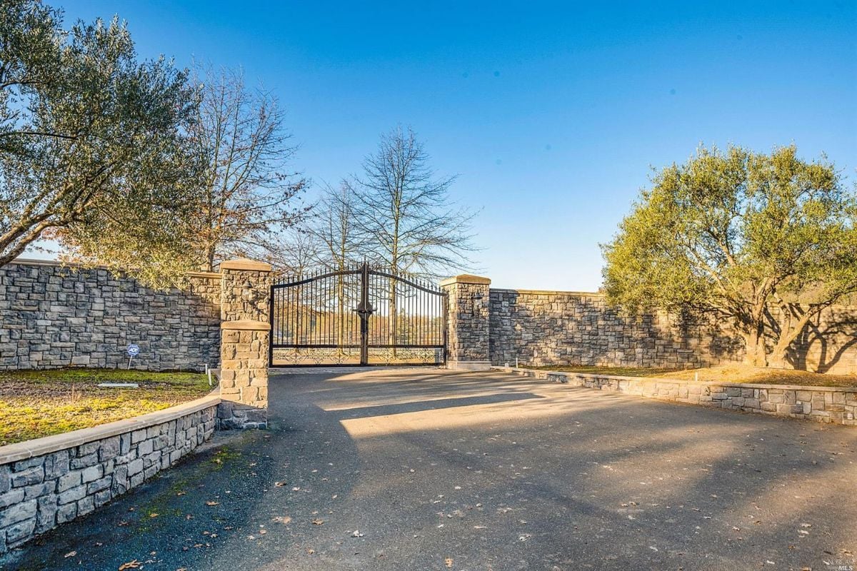 Gate with paved driveway.