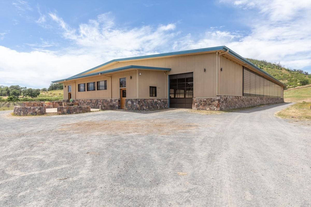 Barn with an attached living space for staff or guest.