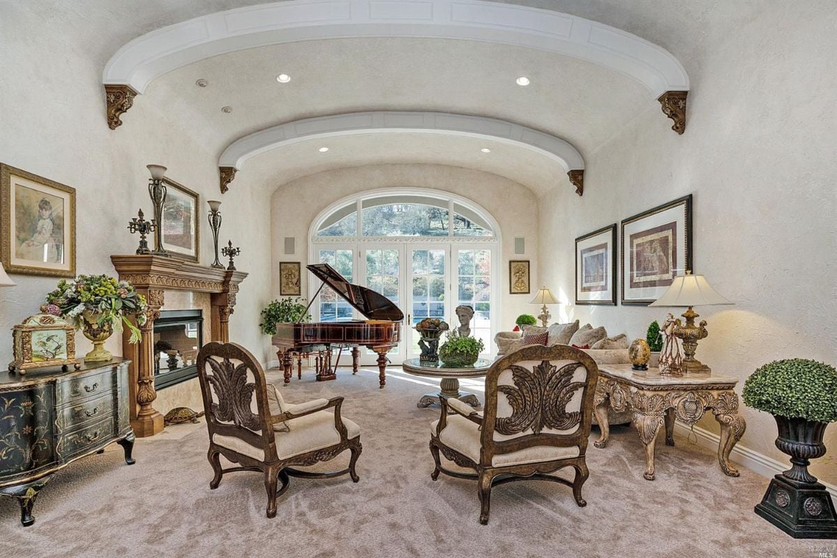 Living room with a fireplace and piano.