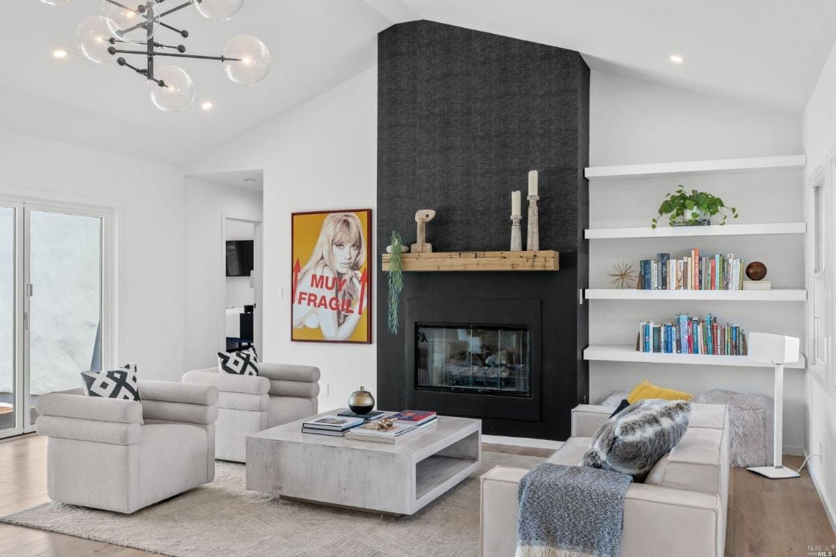Living room with a fireplace and Cathedral ceiling.