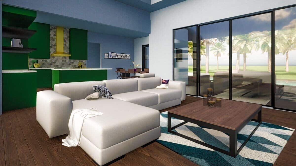 Living room and kitchen with hardwood flooring and sliding glass doors that open to a covered patio.