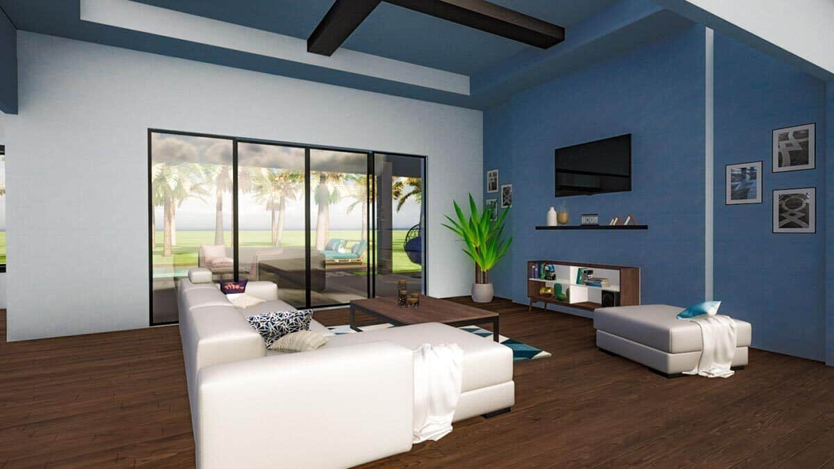 Living room with a wall-mounted TV, an L-shaped sofa, and a metal coffee table under the blue tray ceiling.