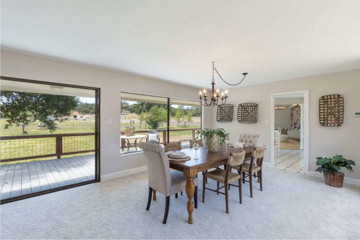 Dining room with a wooden table and chairs.