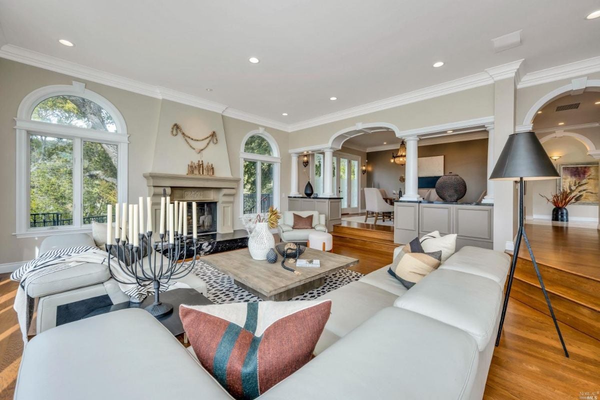 Living room with a fire place and couches.