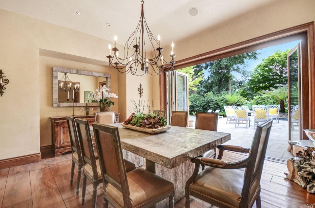 Dining room with wooden dining table and chairs.