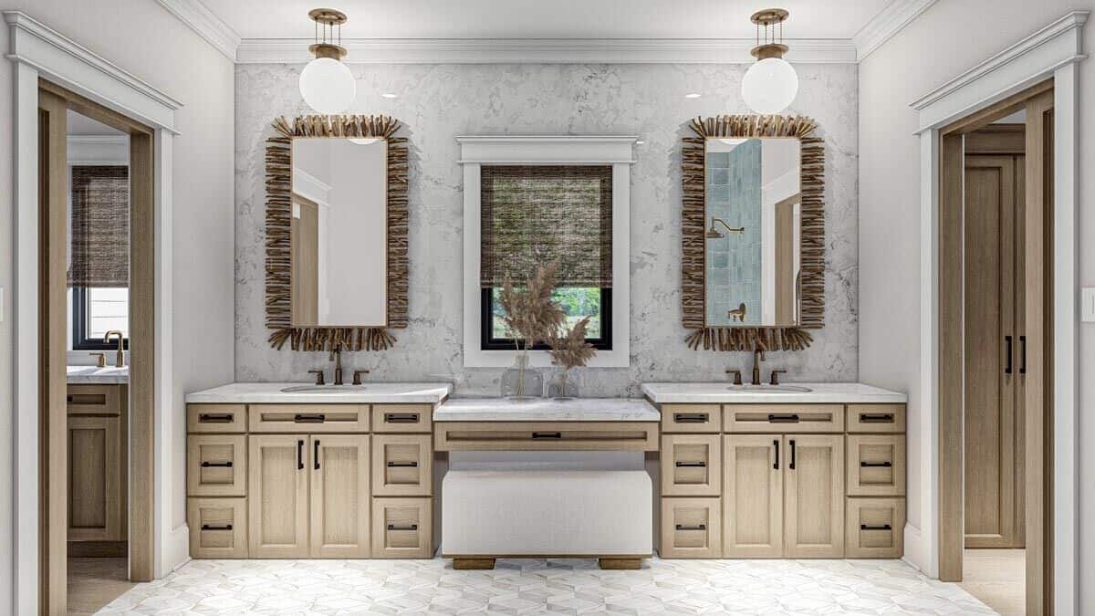 Primary vanity with two sinks, a makeup counter in the middle, and decorative mirrors.