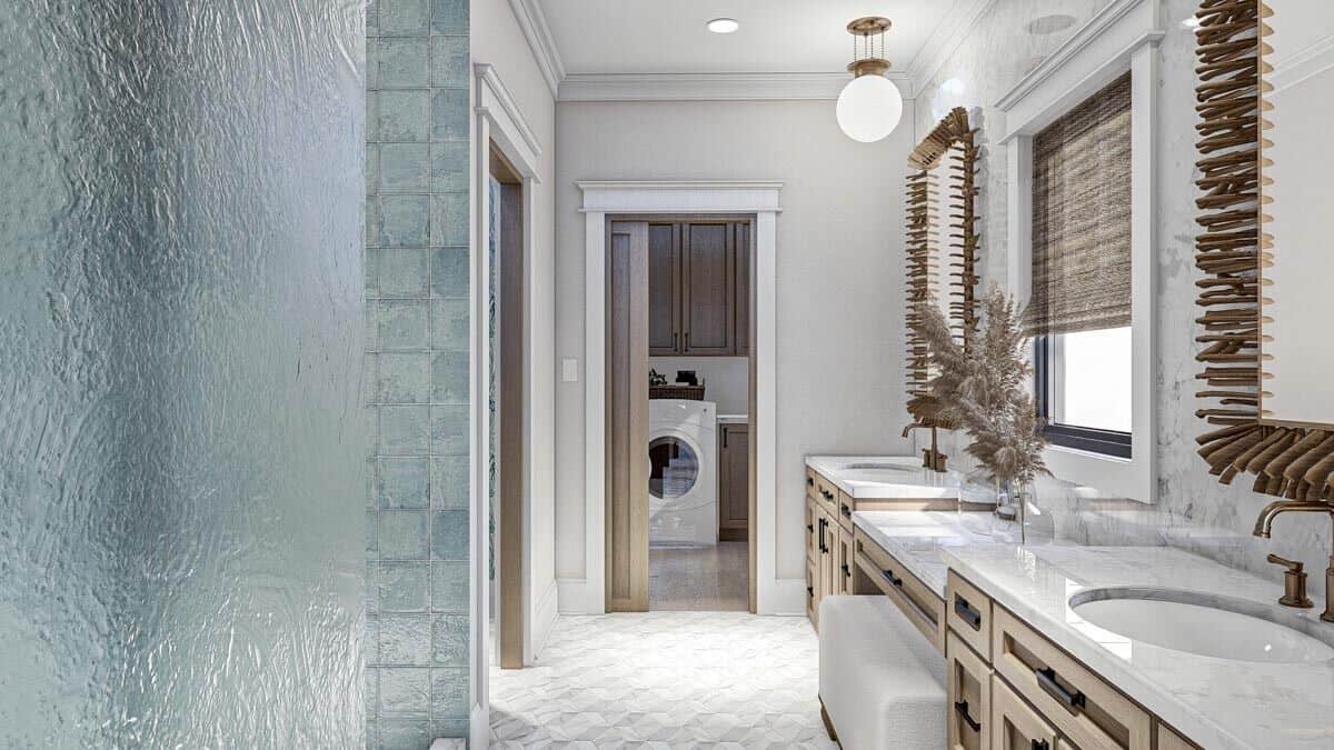 The primary bathroom includes direct access to the laundry room through a pocket door.