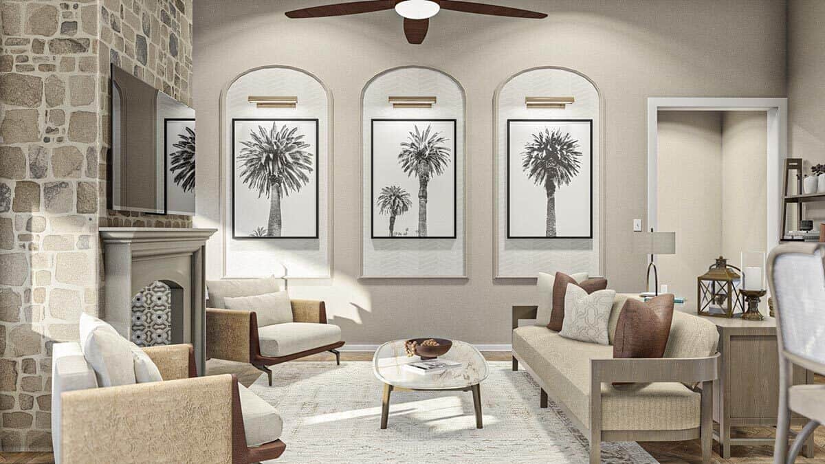 Great room with cushioned seats and a fireplace topped with a TV.