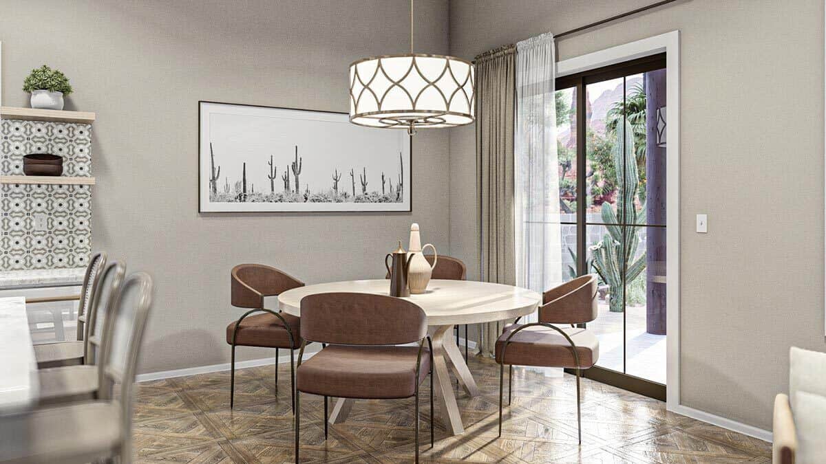 The dining area offers a round dining set and direct patio access through sliding glass doors.