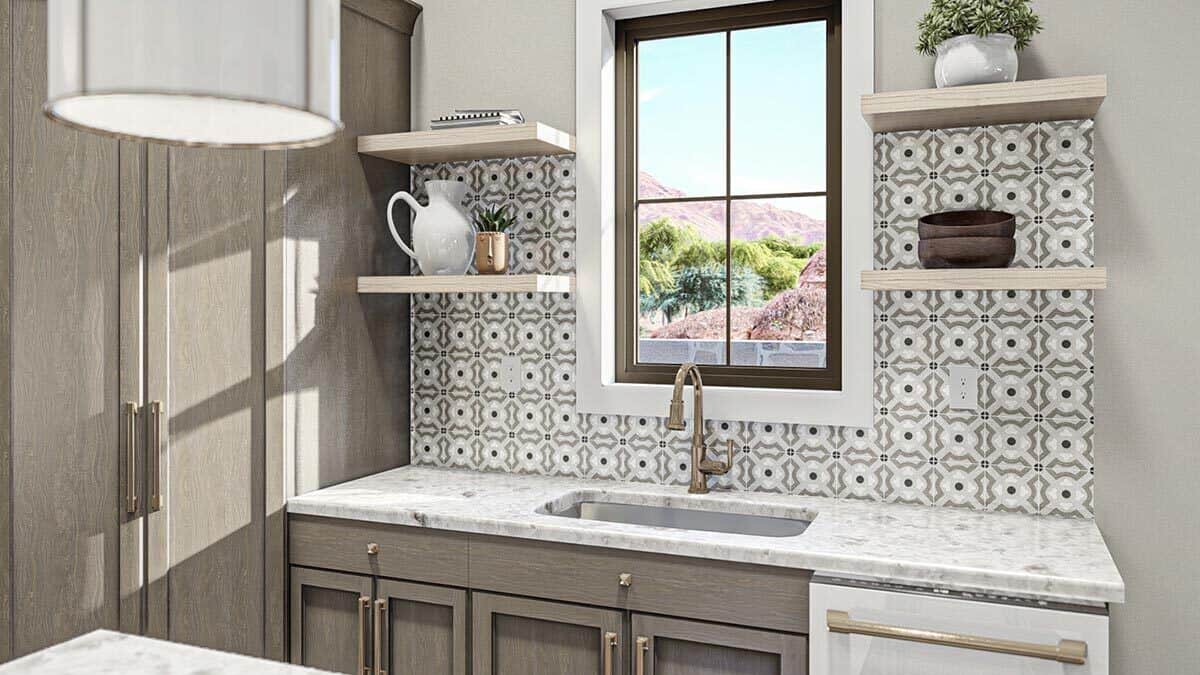 A window above the sink provides the kitchen with natural light and scenic views.