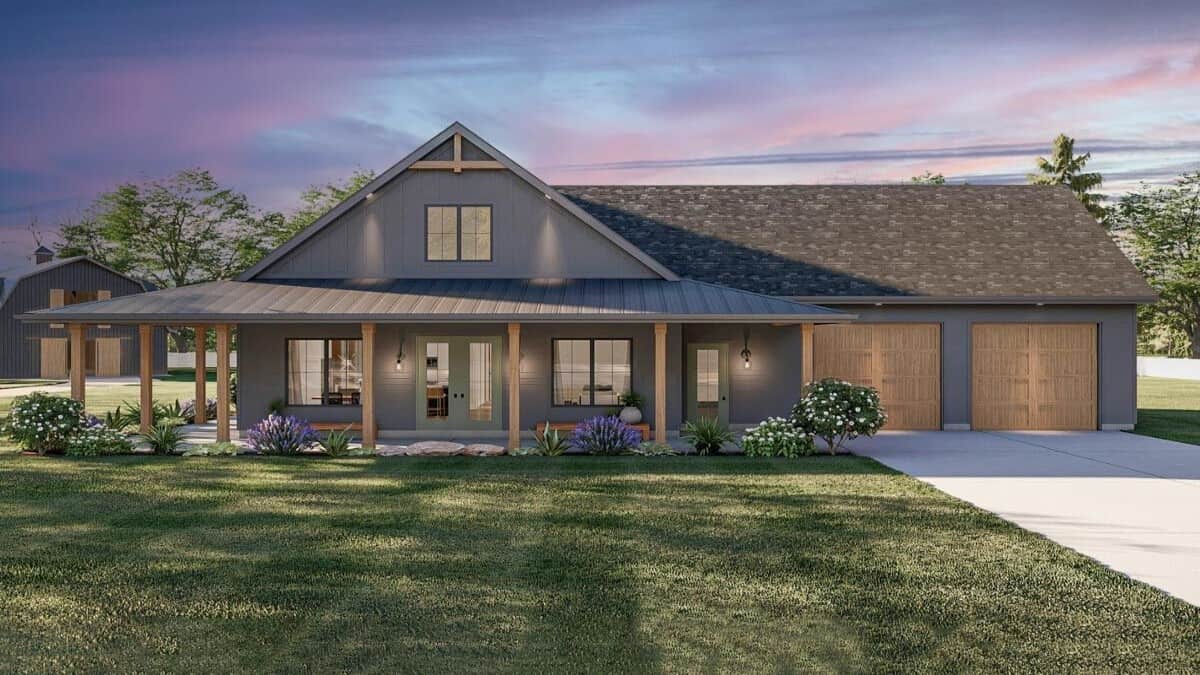 Front rendering with a covered entry porch and a double garage with concrete driveway.