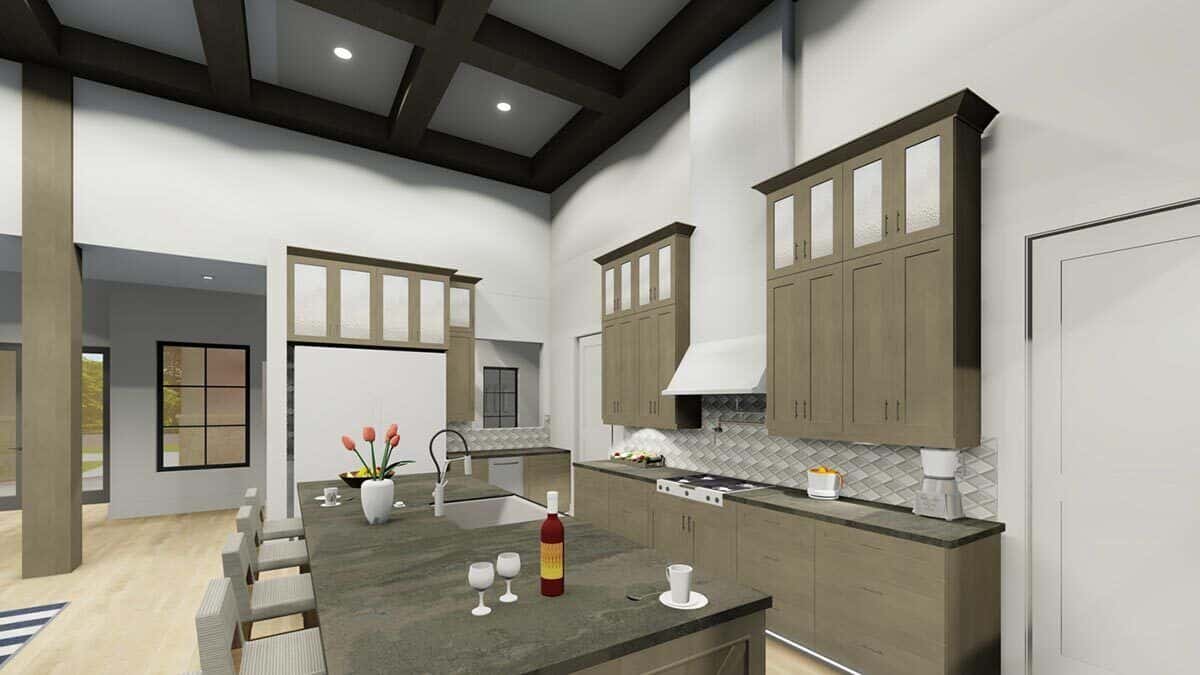 Kitchen with wooden cabinets, modern appliances, and a breakfast island with bar seating.