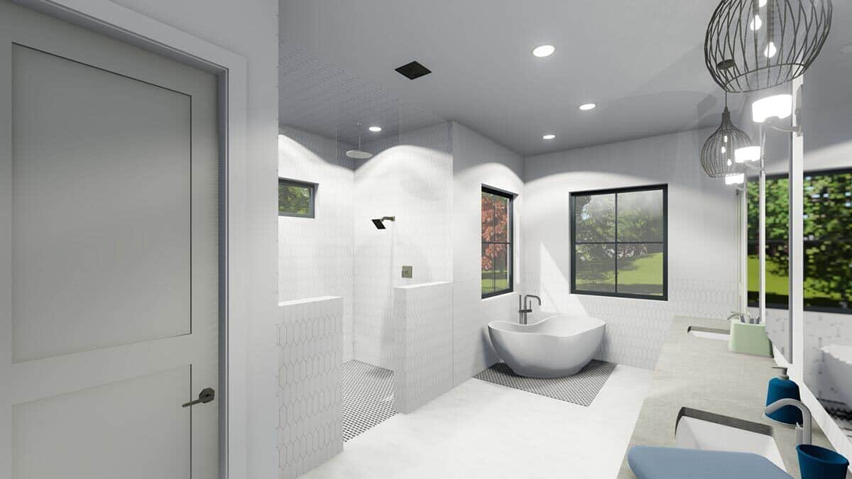 Primary bathroom with a dual sink vanity, a tiled shower, and a soaking tub illuminated by aluminum-framed windows.