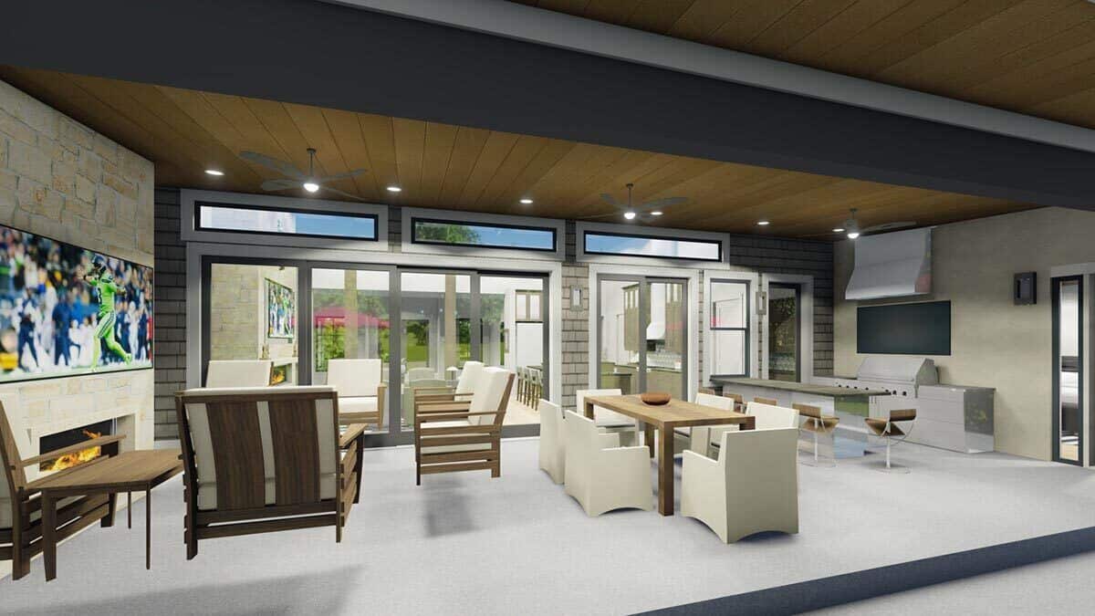 Covered patio with a stone fireplace, cushioned seats, an outdoor dining, and a summer kitchen.