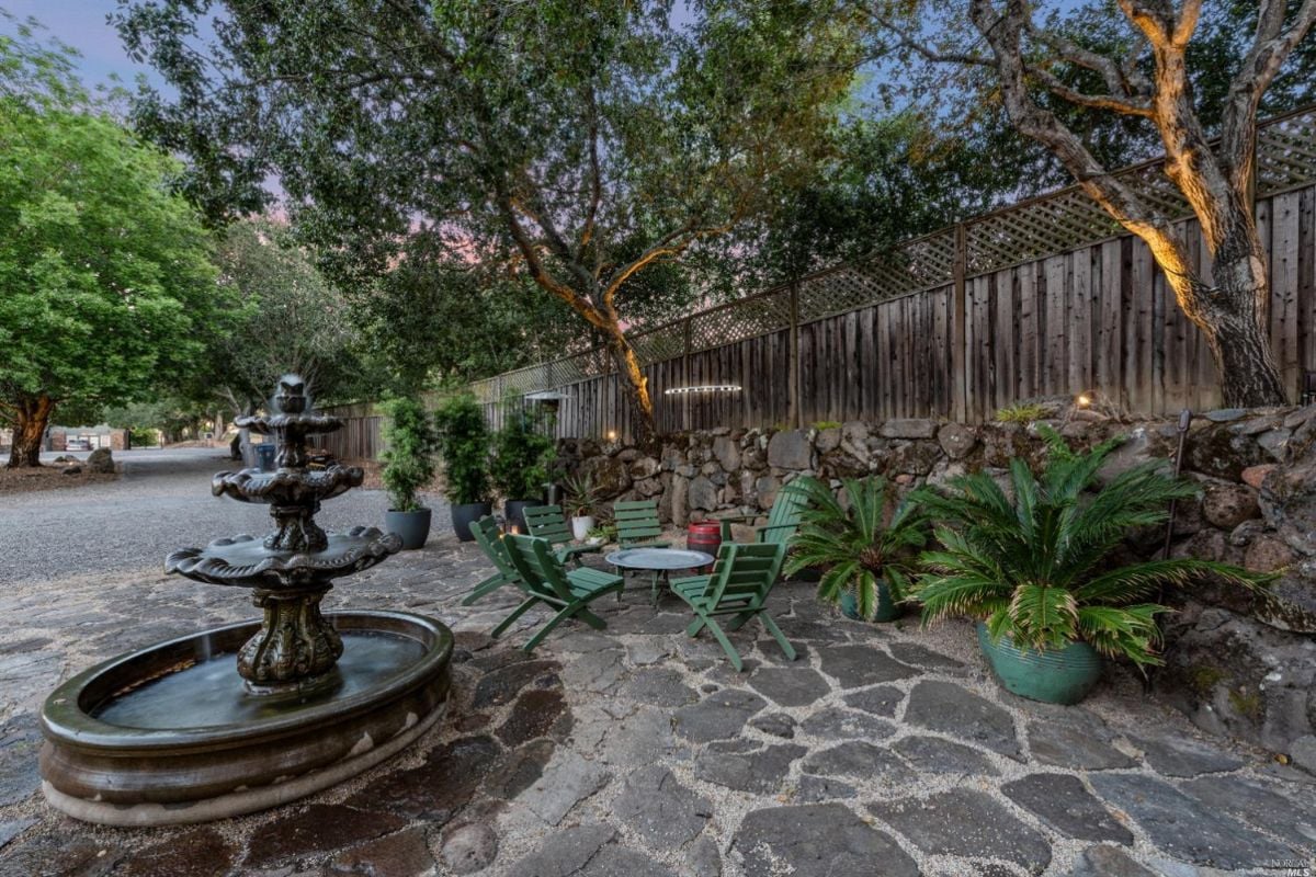 Fountain with table and chairs.
