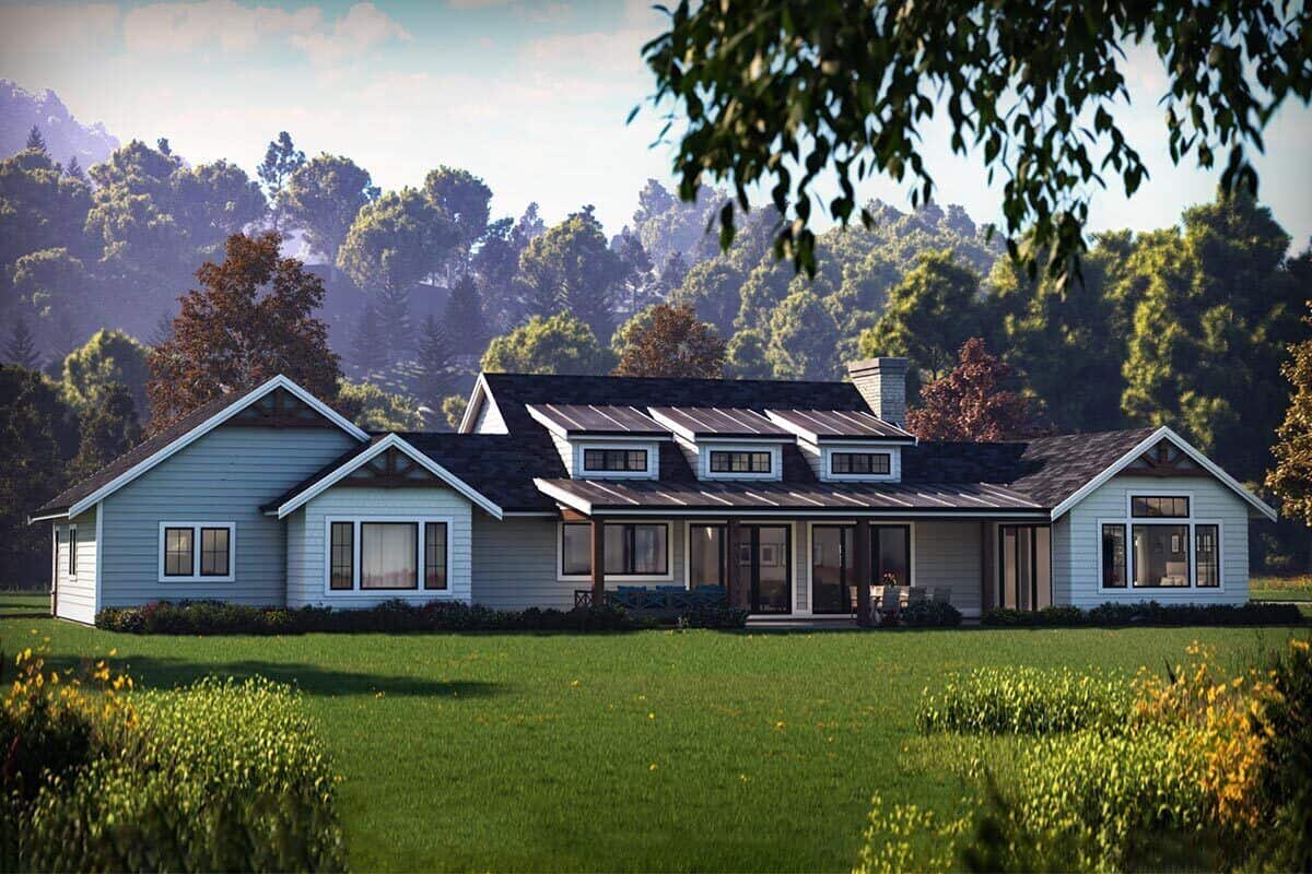 Rear rendering with gable rooflines and a covered patio topped with three shed dormers.