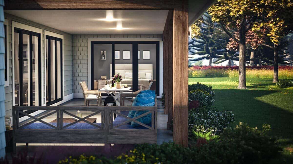 Covered patio with sliding glass doors, an outdoor dining set, and an L-shaped sofa over concrete flooring.