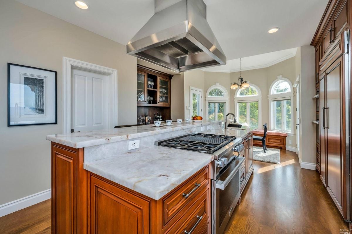 Kitchen with a stove and a large island.